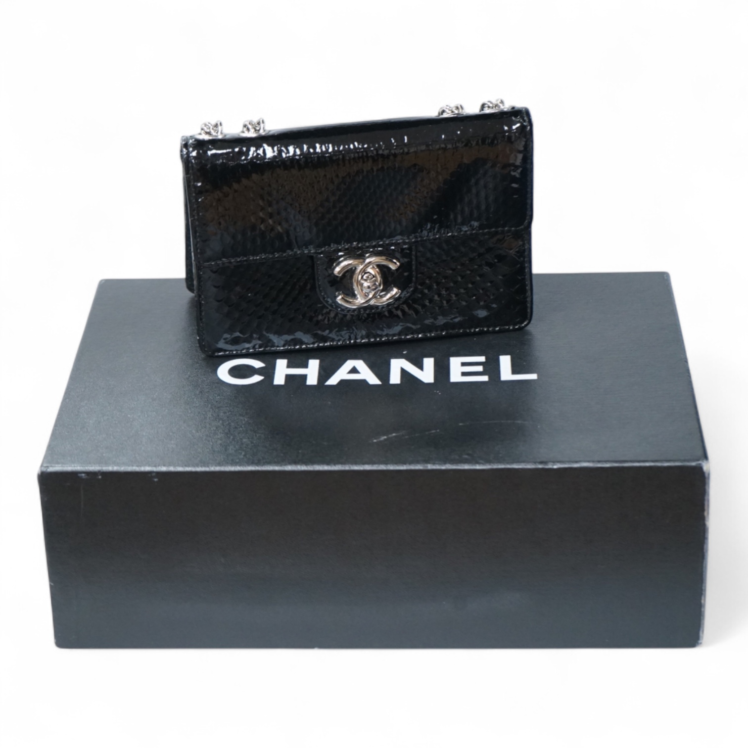 A Chanel patent black mini python handbag with silver hardware, date code 12008922, with dust bag, original paperwork, authenticity card and box, 17cm wide, Provenance: Purchased by the vendor Paris